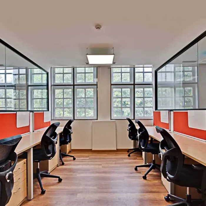 Desks along the window wall of the New Delhi office.